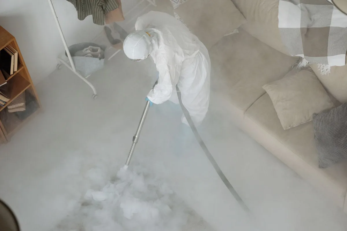 Biohazard cleanup technician in protective equipment, Fallon, NV